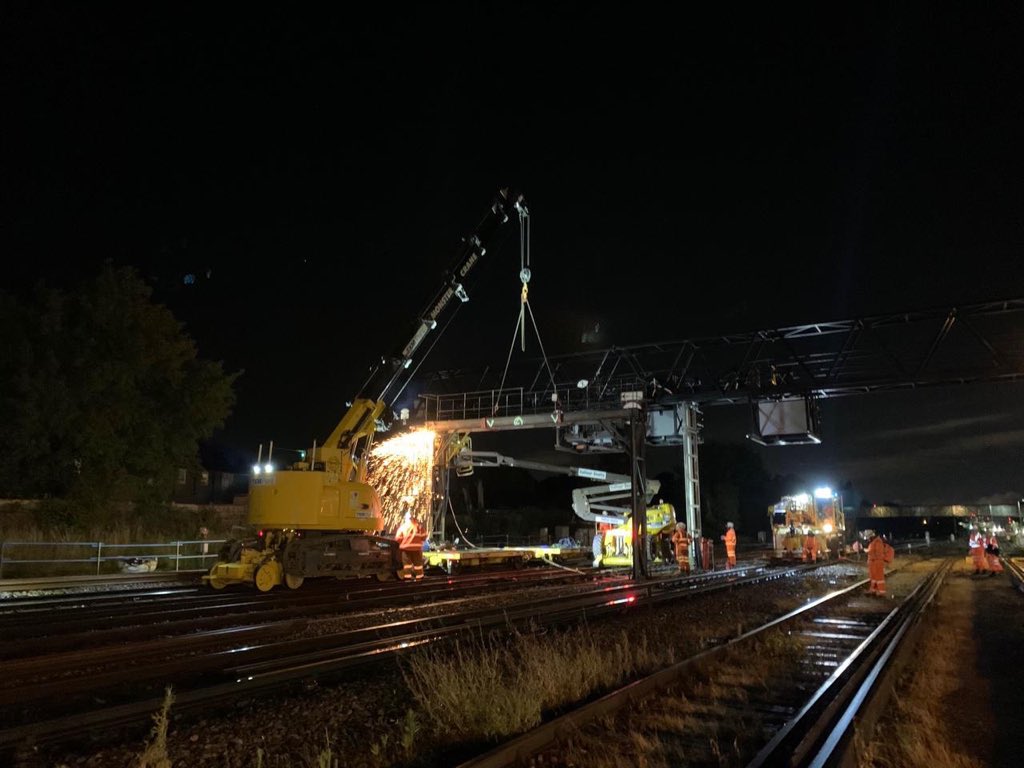 NetworkRailSE's tweet photo. Work continued through the night on the #HitherGreen resignalling project. Here’s a couple of nice shots of some of the signal gantries being replaced and refitted by the civil engineering teams ready for operation on 3 August. @Se_Railway https://t.co/RBZ5rZPABt