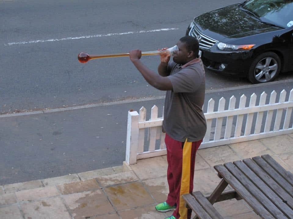 PictureSporting's tweet photo. Love this photo of Rahkeem Cornwall downing a yard of ale while playing for @ThamesDittonCC in Surrey in 2013.  A lovely club,and another one with the ground and pavilion separated by a road https://t.co/S7j5K9J1my