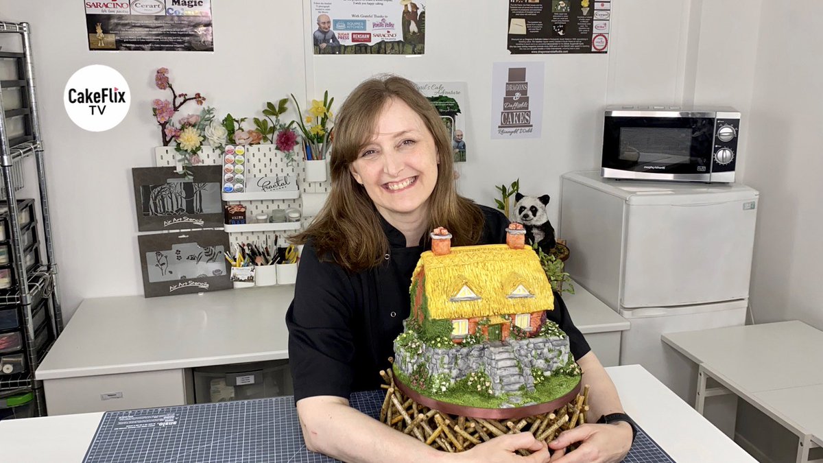 Sharing my latest tutorial for <a href="/Cakeflix1/">CakeFlix</a> - my little country cottage.  A tasty vanilla sponge with white chocolate ganache and sugarpaste covering, textured and painted by hand then finished with a miniature tree. When can I move in? #cake #illusioncake #cottage