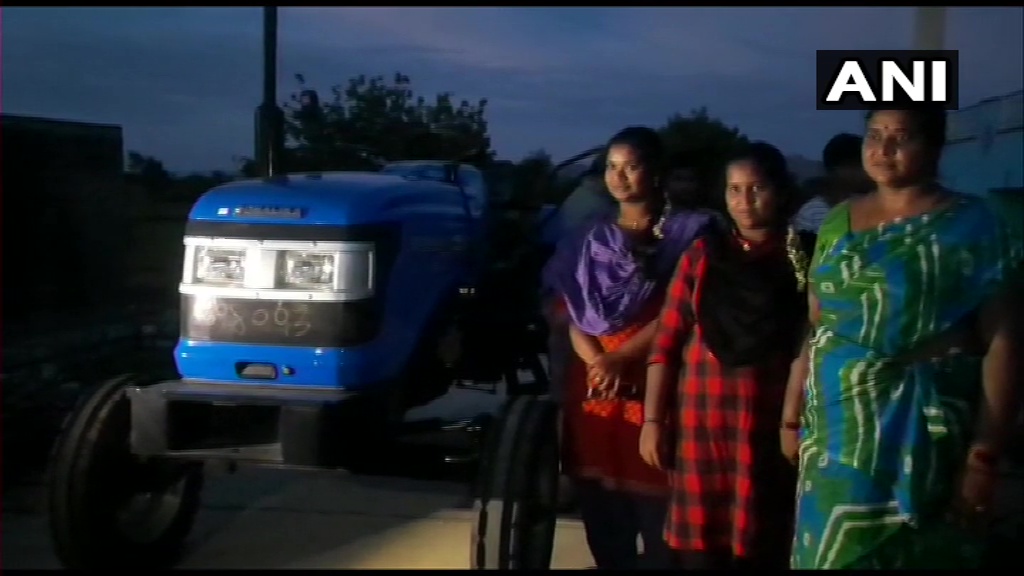 ANI's tweet photo. Andhra Pradesh: Actor Sonu Sood provides a tractor to the two girls who were seen in a viral video ploughing a farm in Chittoor with a yoke on their shoulders. https://t.co/GNd0tdkKIw