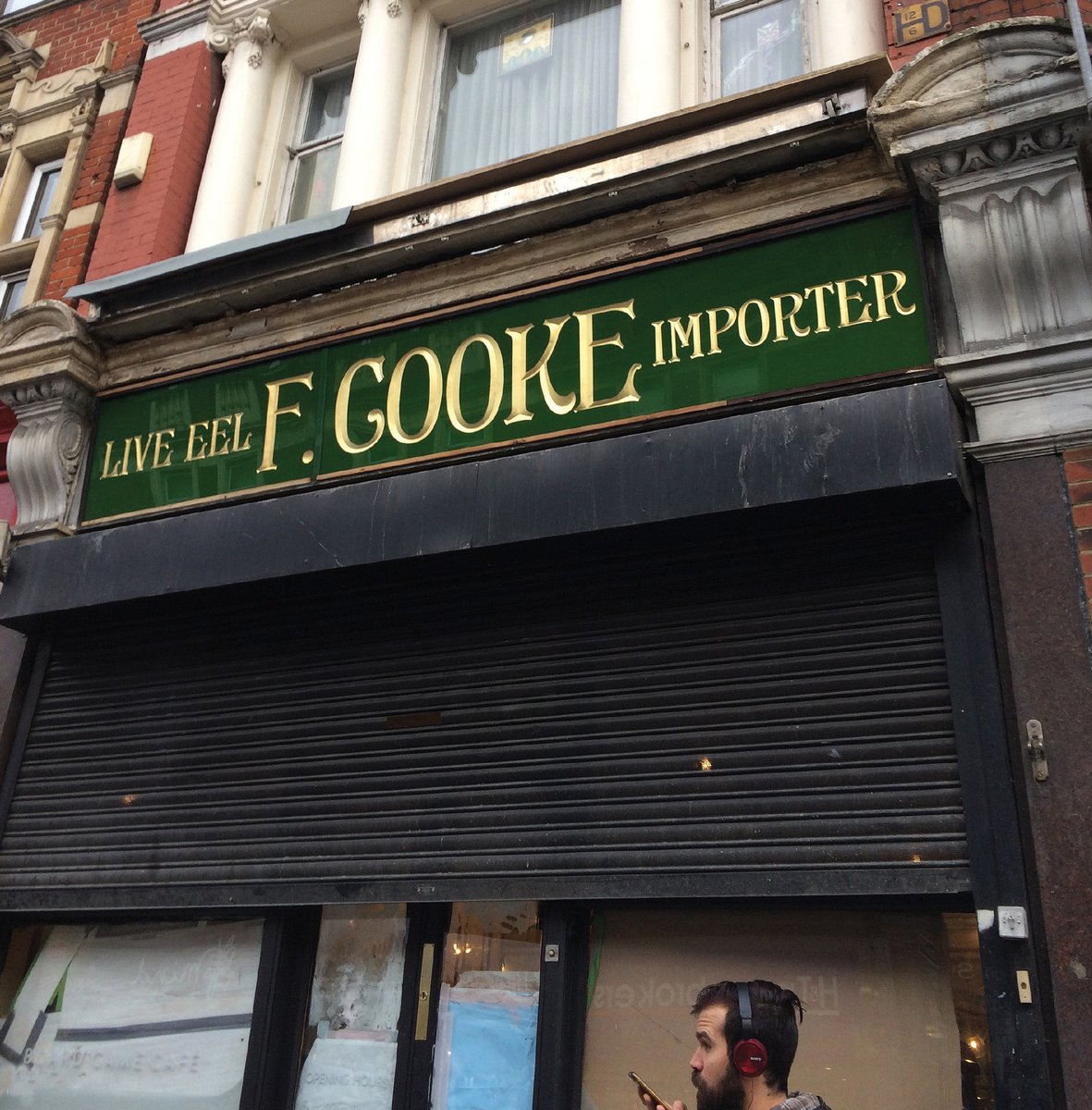 sarahhyndman's tweet photo. Forgotten and rediscoverd shopfront when a new sign was taken down in Dalston for #FontSunday with @DesignMuseum &amp; Georgios Makkas? https://t.co/uPM9rkzvFV
