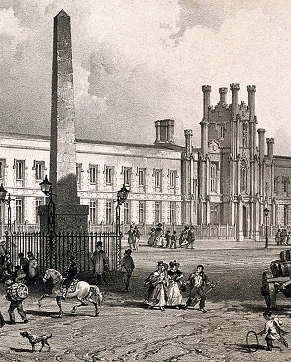 The lighting around the obelisk has been much improved with four - presumably gas? - lamps attached to the railings; notice the crossing-sweeper with his long broom escorting the ladies through the shit, for a small tip, and the child, dressed in a sensible smock, operating his
