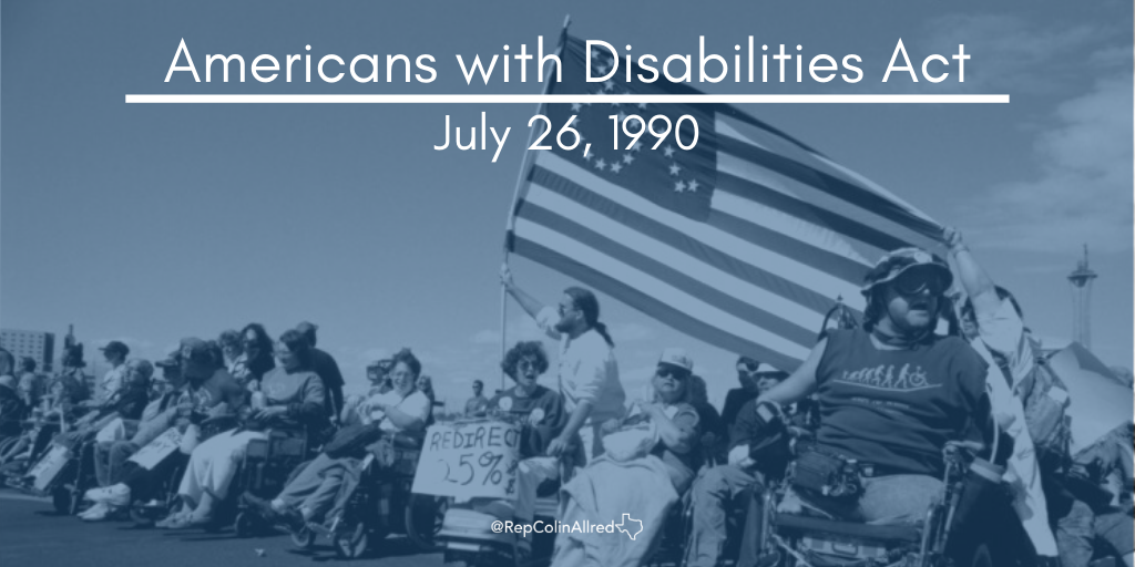 People seated in wheelchairs with an American flag, stars on the flag form symbol of person in wheelchair.
