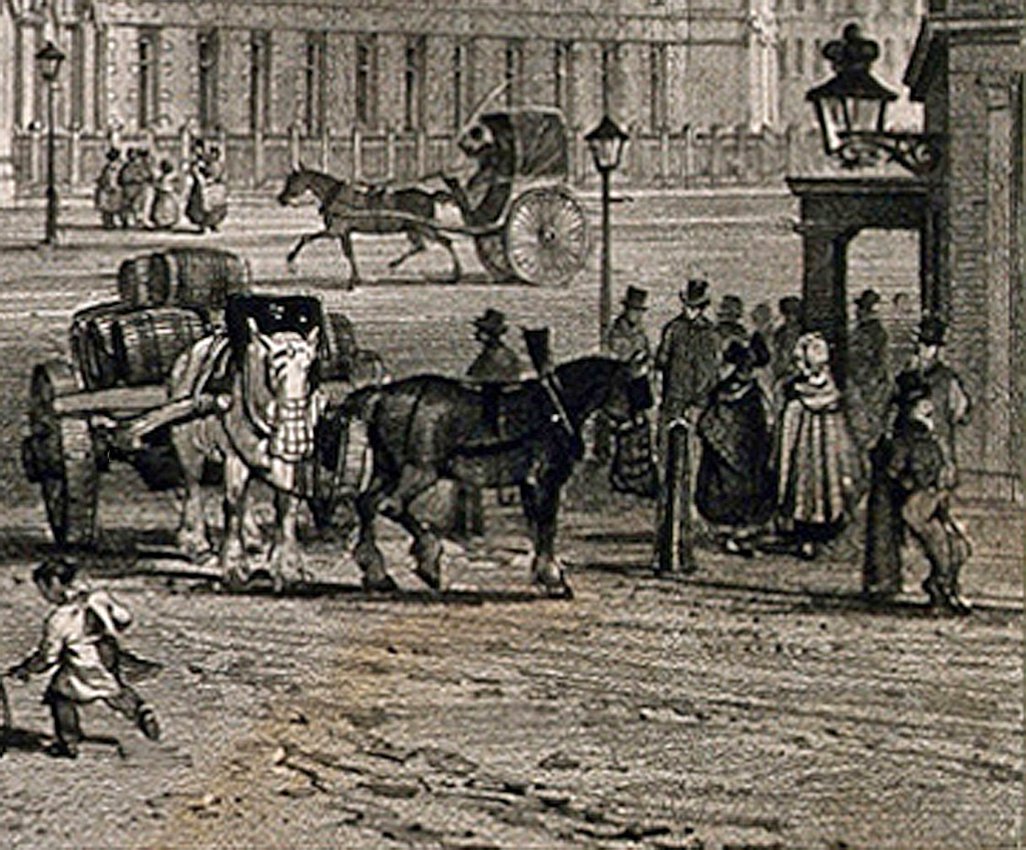 Another single-seater gig in the background, with the driver whipping-up his horse to greater speedIn the foreground a brewer's dray delivering barrels of beer to the pub on the corner, note the heavy horses with their nosebags, the darker one doing that funny tipping thing with