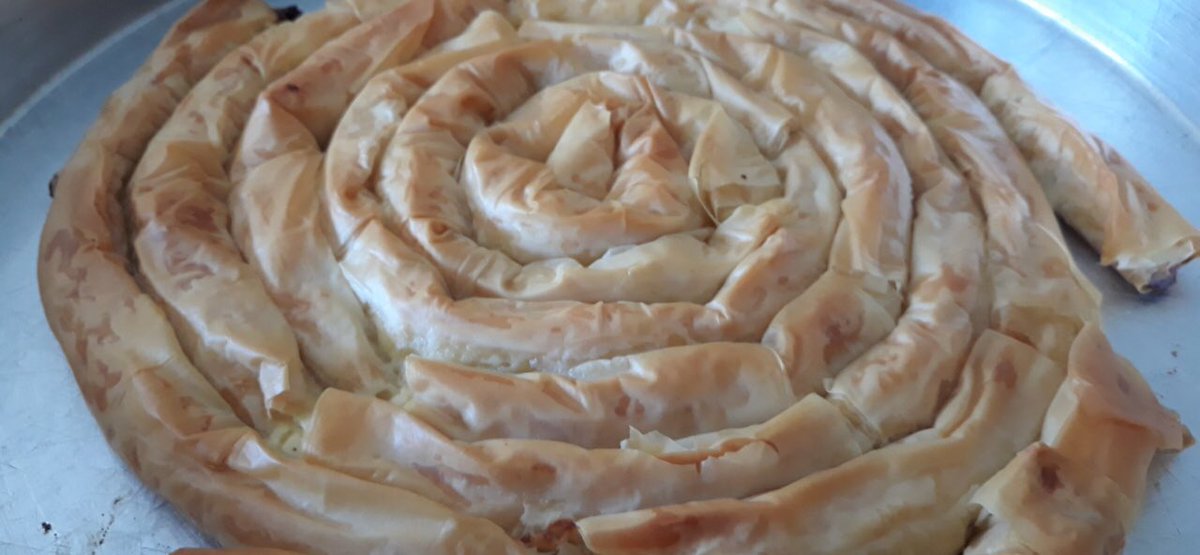 greekmiss's tweet photo. Havenβt posted in a while but still on the #coronabaking trip. Today we have Greek strifti tiropota or Greek cheese pie made in a circular pattern #baking #bakinggoals #wanttobeabaker #yummy https://t.co/nUuTNLeGlq