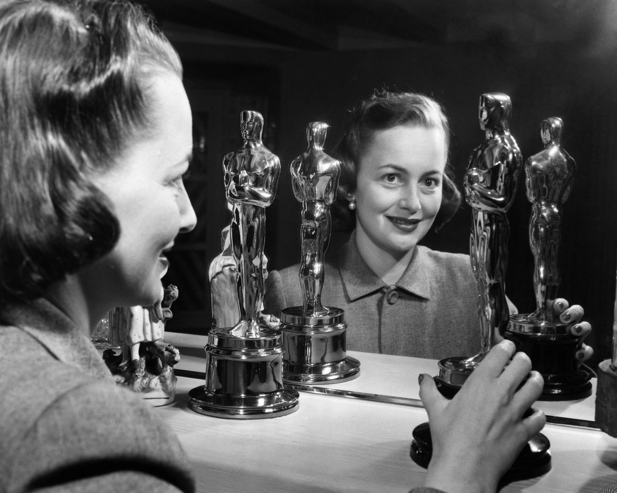 Olivia won her second Oscar for The Heiress (her first was 1947’s To Each His Own) and here she displays them proudly on her mantle.