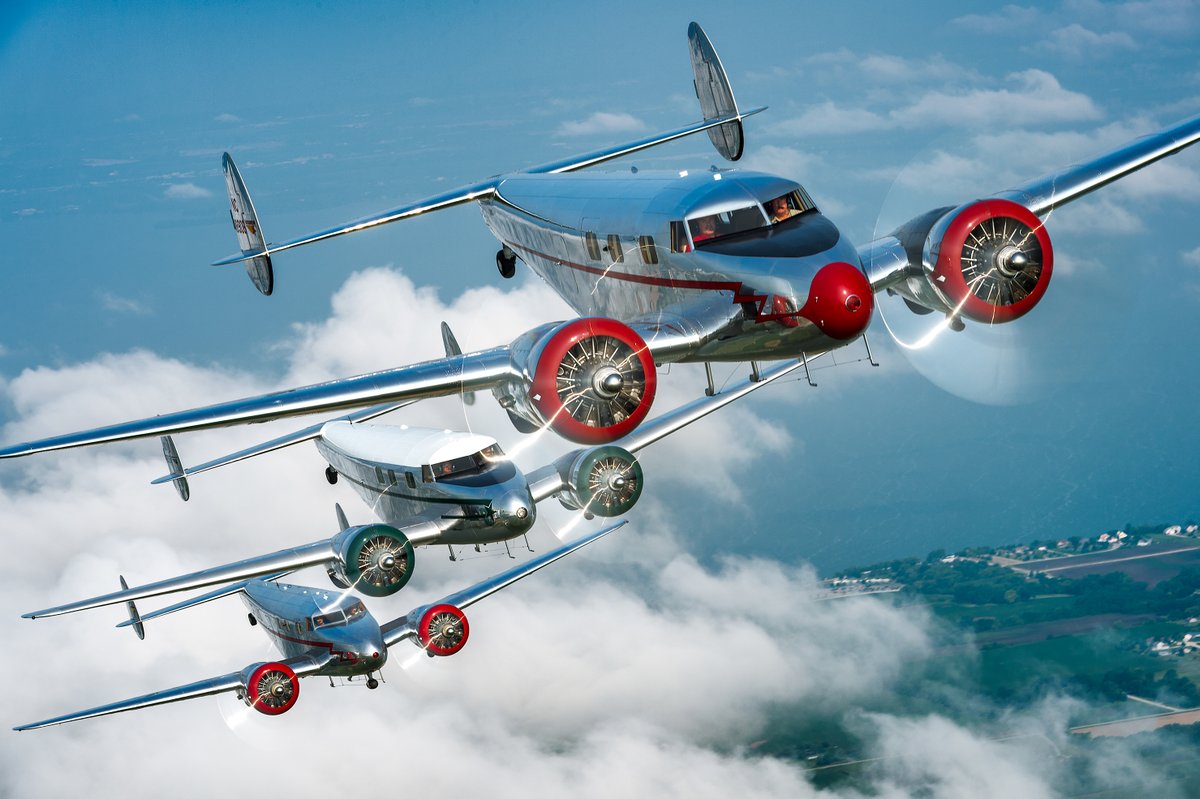 EAA's tweet photo. During the week that would have been #OSH20, we figured we'd share some of our favorite throwback photos from Oshkosh through the years! From 2014: A trio of gleaming Lockheed 12 Electras formed up tight over Oshkosh. 📷 Tyson Rininger #EAAtogether https://t.co/YXf19Uz1Rq