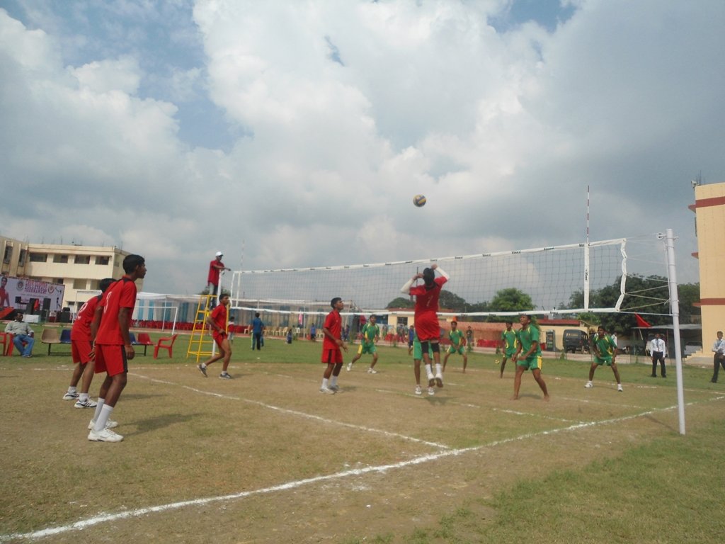 9/nThe bright tricolor  was shaping that short figure of Sir. He was a little shorter than me but he used to shoot volleys in volleyball with same power as much powerful used to be his football kick.Pic: Cadets playing Volleyball in school.