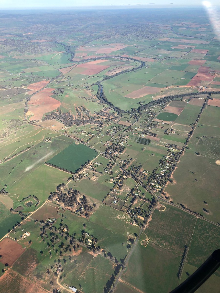 LucyThack's tweet photo. In July 2019, this devastating photo of drought-stricken Dubbo was taken from the air after take off.  One year on - after 537mm of rain, according to the BOM - this is the transformation. https://t.co/N5dG1uUQ6v
