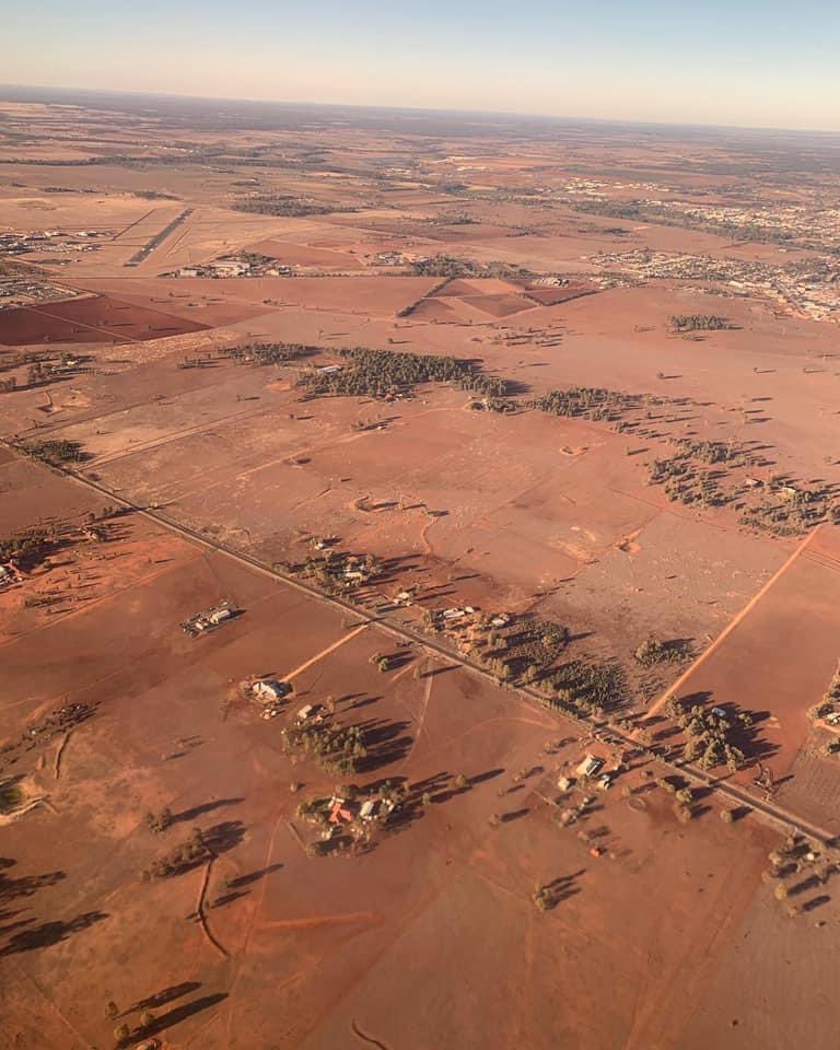 LucyThack's tweet photo. In July 2019, this devastating photo of drought-stricken Dubbo was taken from the air after take off.  One year on - after 537mm of rain, according to the BOM - this is the transformation. https://t.co/N5dG1uUQ6v