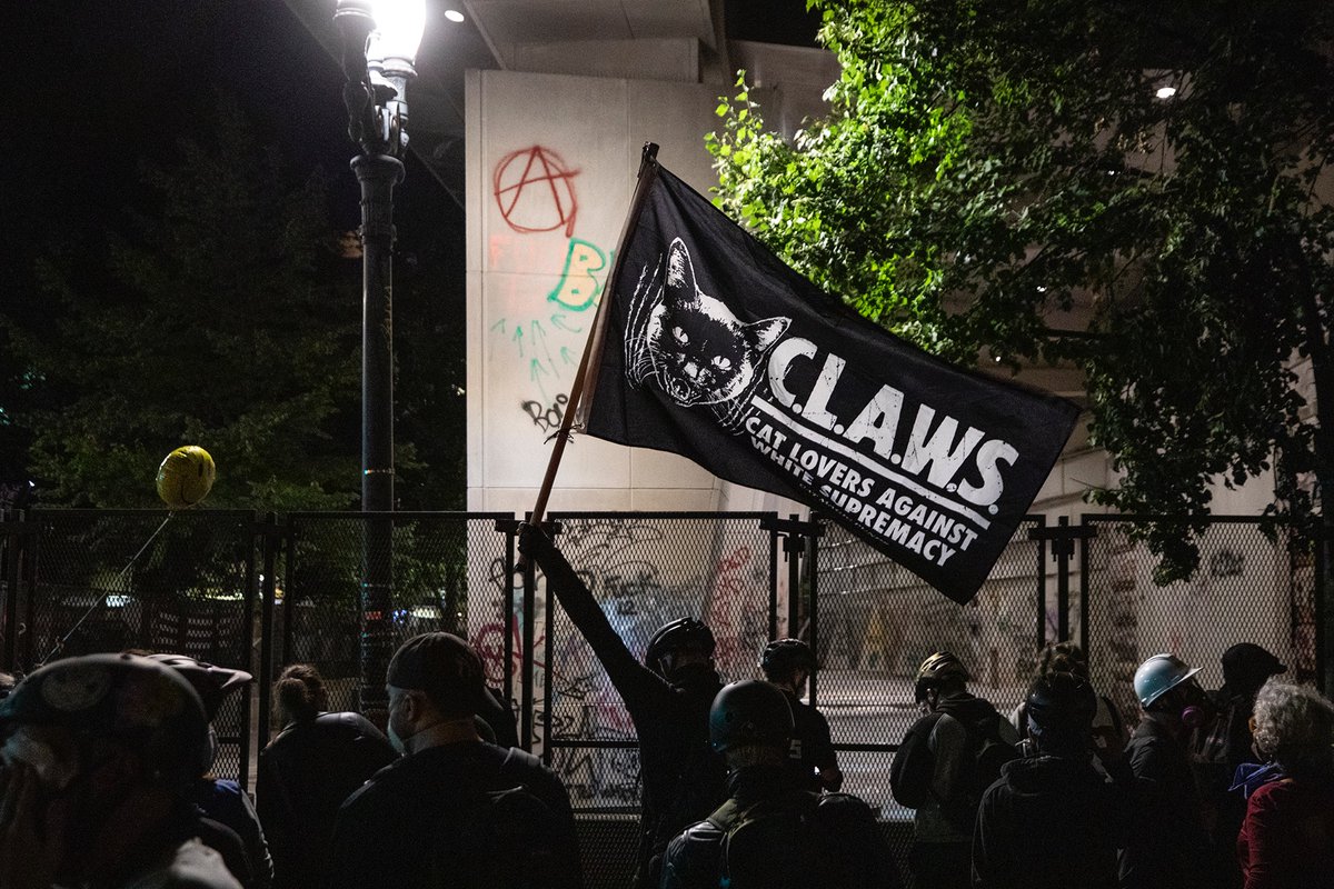 I wasn’t at the earlier march, but  @PDXzane was there. When I arrived at the FC, the crowd was large and energetic. A couple of my visual favorites were the CLAWS flag and the angry frown face.