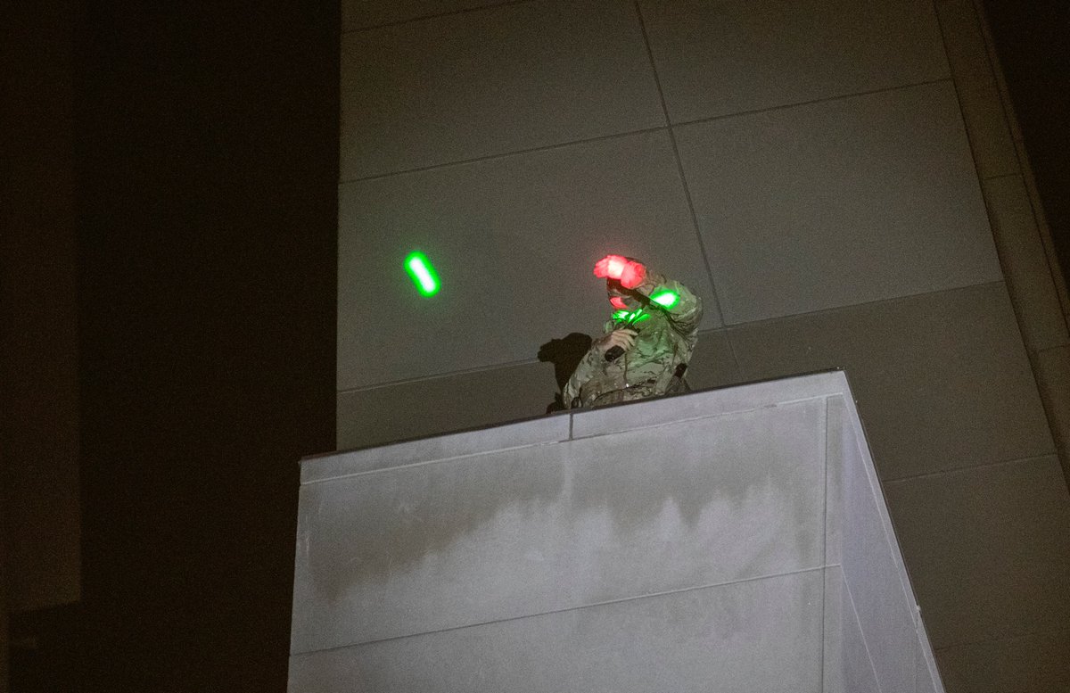 Events picked up as protesters banged and shook the fence. Tear gas canisters were thrown over and back again. Protesters used laser pointers on a spotter that was positioned high up.