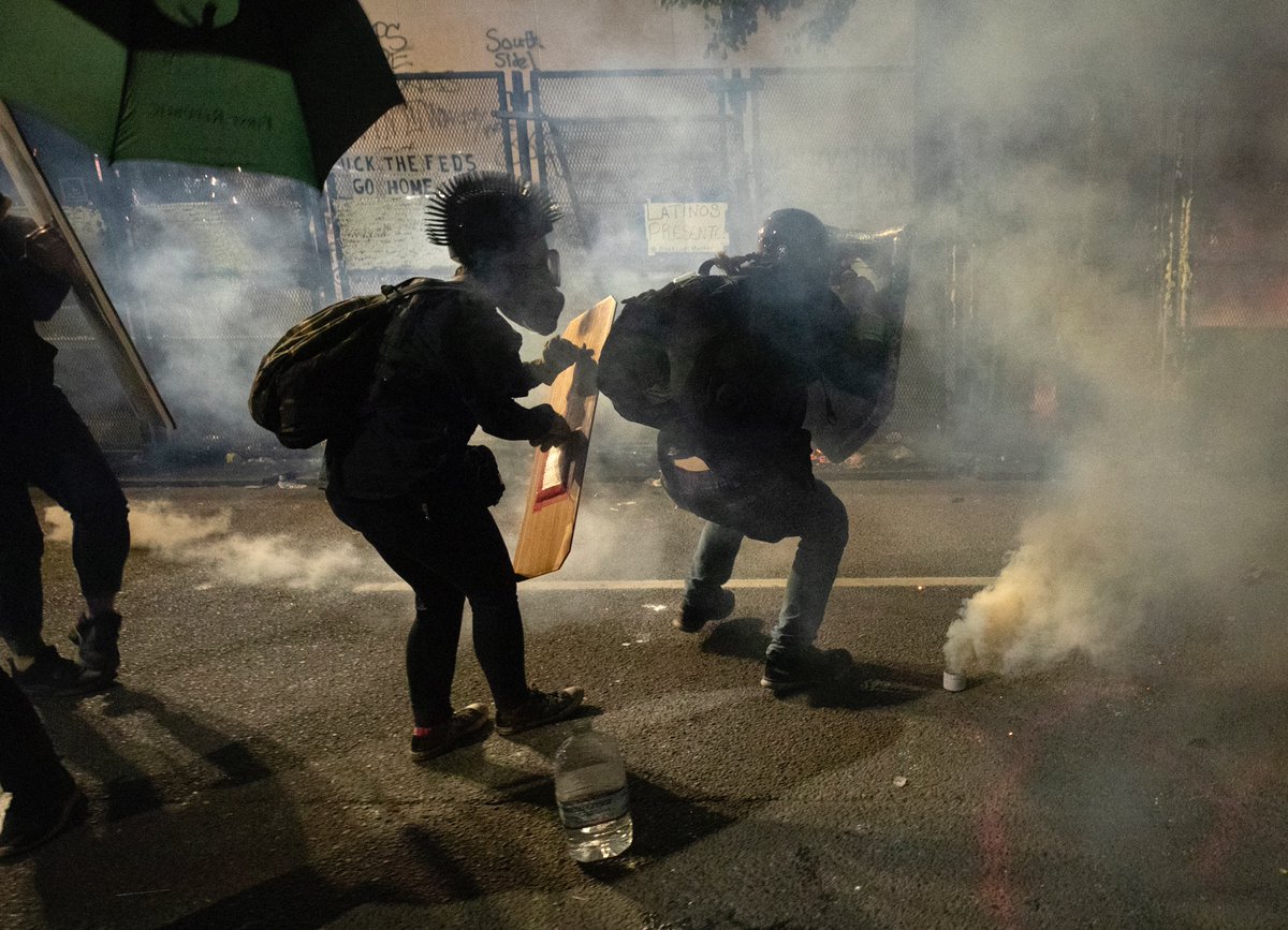 There were multiple attempts to pull the fence down on the north side of the building. At one point I heard that part of the south side fence came down. Around then, the feds came back out to clear the street.