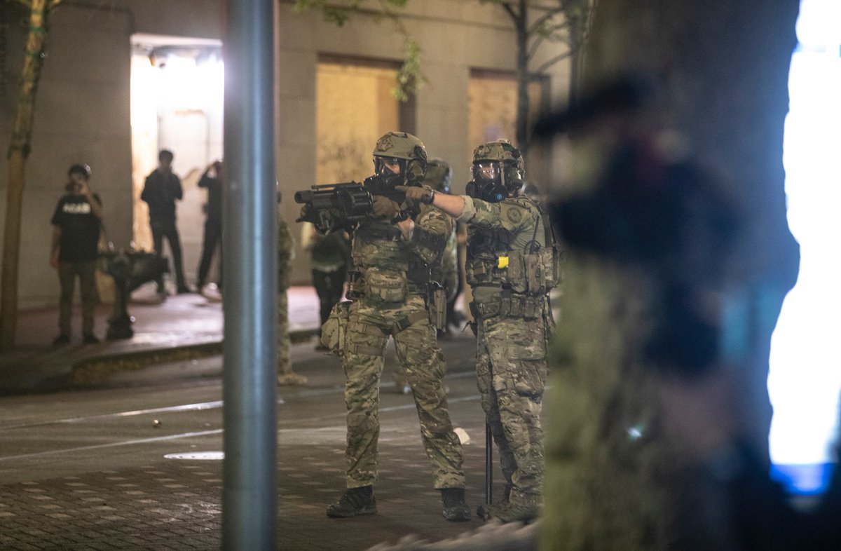 Federal agents continued to push forward with crowd control munitions. The second and third photos aren’t the cleanest, because I was taking cover against a tree as more munitions were being unloaded down 5th Ave., where I was standing.