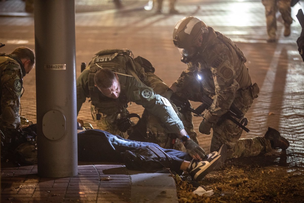 After they moved, I walked to Main and 5th. A protester whom earlier was being helped through clouds of tear gas by two people, now lay motionless on the ground. US Marshals checked on her until she came to. I heard she had a seizure. She eventually rose and walked off with help.