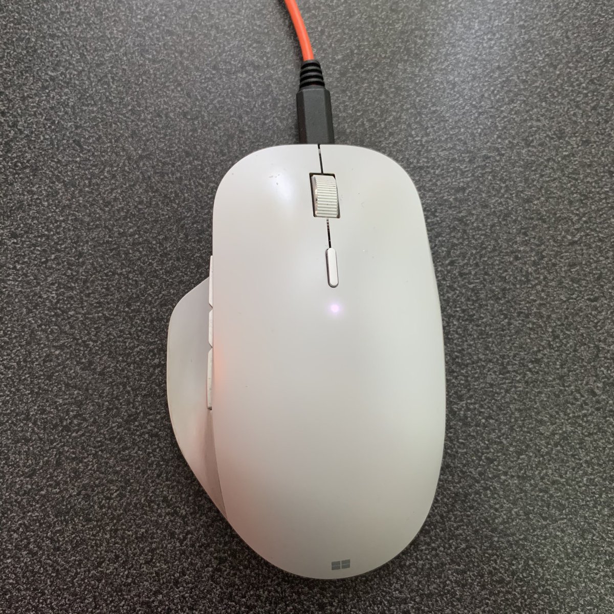 SoniaCuff's tweet photo. So much time on my #SurfaceBook means my poor little mouse is running out of energy. Glad I can plug it in to charge and keep using it at the same time. Red USB cable so it charges faster ;) 
#SurfacePrecisionMouse 
@surface https://t.co/pLpc2auOON