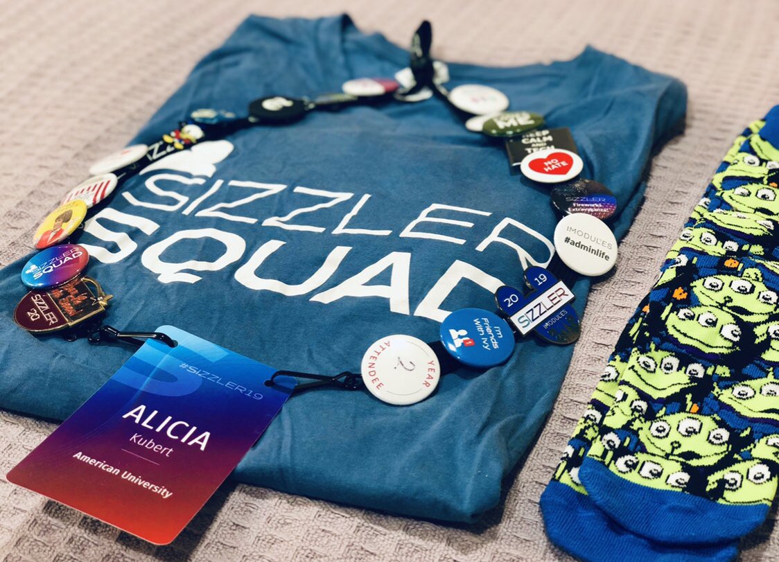 KubertSmith's tweet photo. All ready for #VirtualSizzler and the #SizzlerRedCarpet with last year’s coveted #SocksOfSizzler @iModules trivia win + all the swag! Which piece of flair is your most prized? https://t.co/Klicwzf0zG