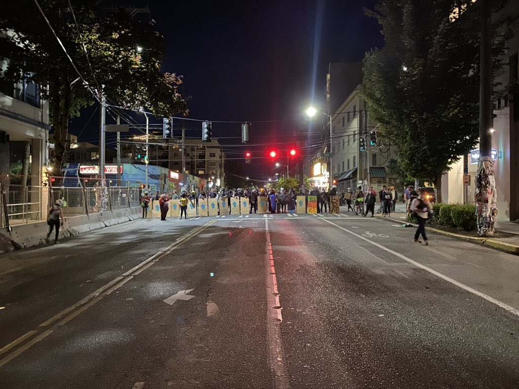 Omarisal's tweet photo. #ProtestSeattle - Protesters remain on 12th and Pine adjacent to the East Precinct. No visible police presence. https://t.co/uf7yaPiboR