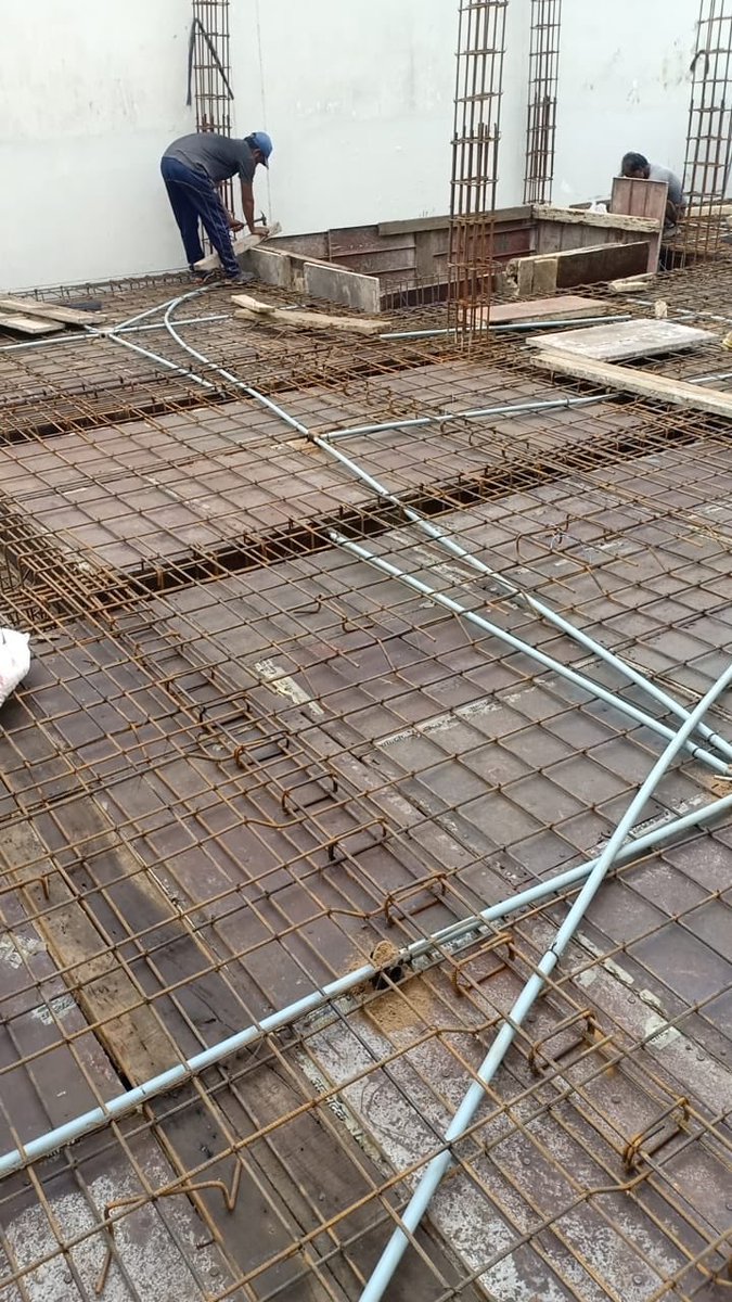 vaidravvi's tweet photo. Slab steel binding finished along with electrical work...ready for casting https://t.co/Q4W75GMYwC