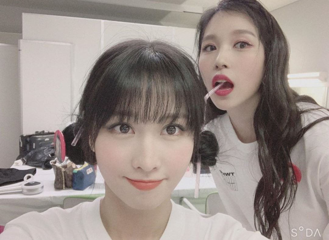 Mina pretending to drink from the straw that was placed in Momo’s buns.