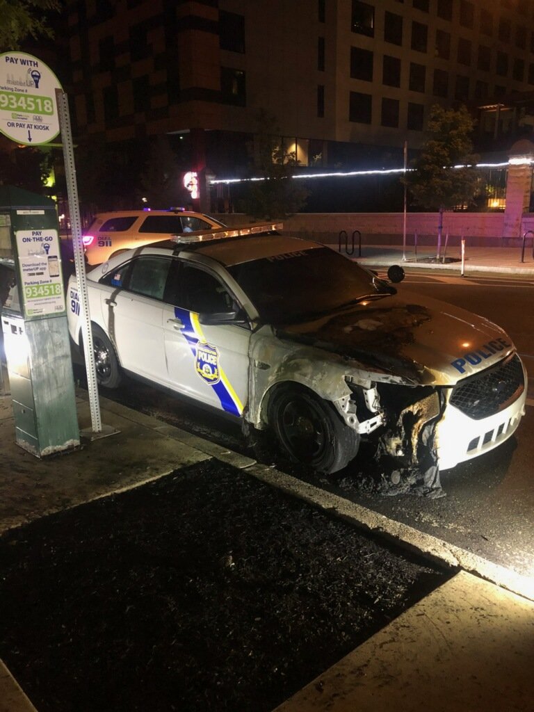 PPDMGillespie's tweet photo. Anyone with info on the person(s) destroying @PhillyPolice vehicles &amp; setting them on fire last night including this @PPD18Dist one @ 40th &amp; Chestnut call 215-686-TIPS. @PPDDerrickWood @ATFPhiladelphia @FBIPhiladelphia @USAO_EDPA @UCDSafe @WestPhillyLocal https://t.co/KxNrw6AbSu
