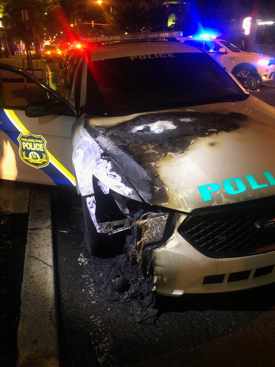 PPDMGillespie's tweet photo. Anyone with info on the person(s) destroying @PhillyPolice vehicles &amp; setting them on fire last night including this @PPD18Dist one @ 40th &amp; Chestnut call 215-686-TIPS. @PPDDerrickWood @ATFPhiladelphia @FBIPhiladelphia @USAO_EDPA @UCDSafe @WestPhillyLocal https://t.co/KxNrw6AbSu