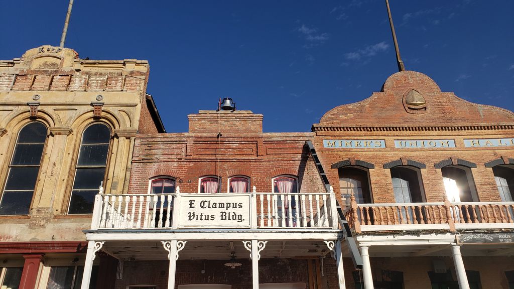 historic4thward's tweet photo. On the left is the #KnightsofPythias building; made of cast iron, stucco, and brick. On the right is the #MinersUnionHall. They are two of the few remaining false-fronted, unaltered buildings in #VirginiaCity; built in 1875 and 1876 respectively. https://t.co/bdTP6f1Rz0