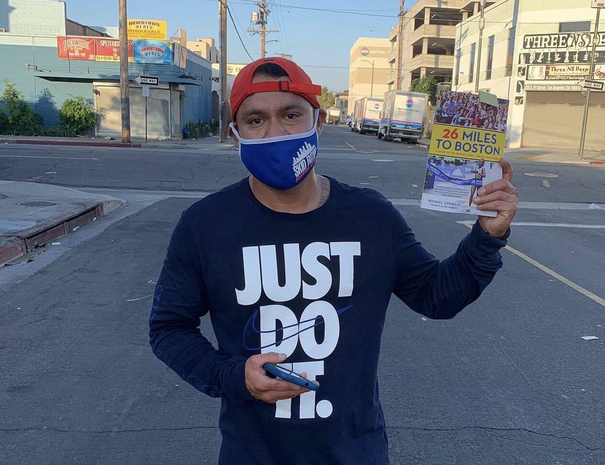 Skidrowrunclub's tweet photo. Miguel, who is very close to qualifying for a #bq, holds up a gift he received from the author #michaelconnely about the history of the #bostonmarathon! #mondaymotivation #26toboston https://t.co/ACHUxwxJgb
