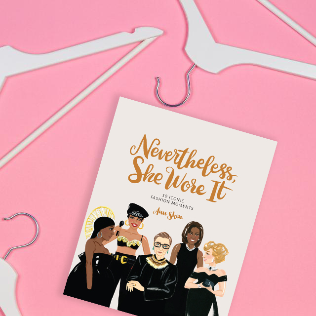 Image of book Nevertheless, She Wore It by Ann Shen on a pink background with white hangers around it. 