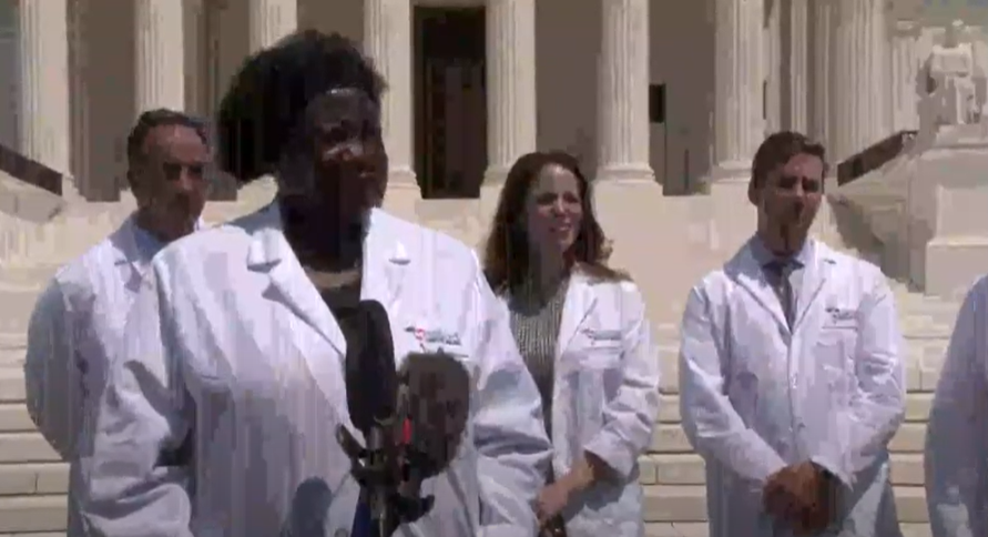 AAPSonline's tweet photo. "When was the last time you put a stethoscope on a patient, Anthony Fauci?" asks front line physician Dr. @stella_immanuel, who is saving patient lives with HCQ, zinc, and azithromycin. LIVE now: press conference on steps of SCOTUS. https://t.co/PIQYuEL8S6 https://t.co/1VO5bZfbBk