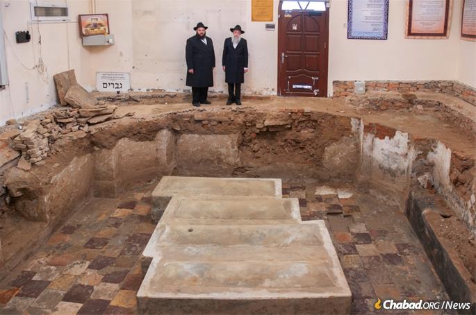 Little did anyone know that five feet below them lay the original, undamaged Ohel, tiled floor and stone bench included, of Rabbi Levi Yitzchak and his three sons. 12