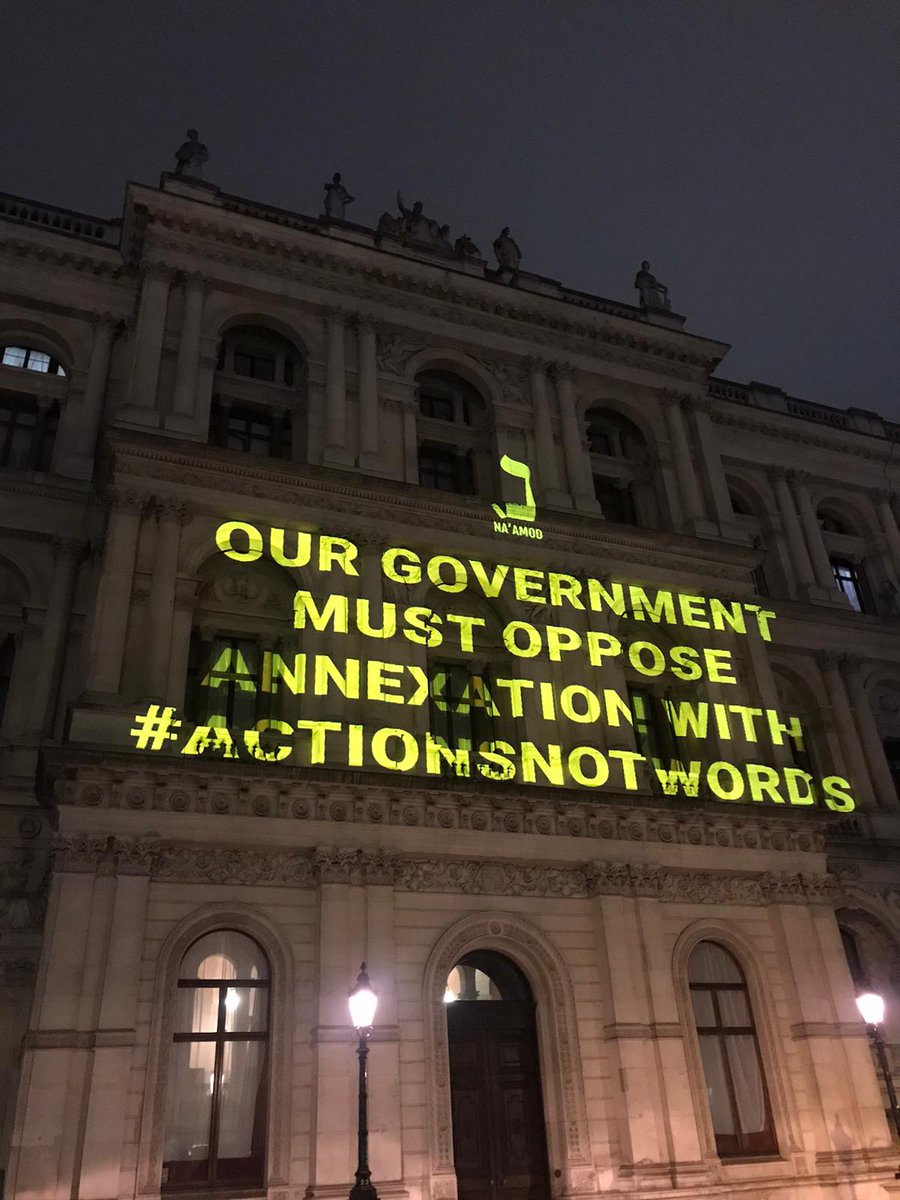 NaamodUK's tweet photo. We're now outside the 
@foreignoffice to send a message to the UK government from British Jews: 

There is no justice without freedom and equality for all Palestinians and Israelis. 

Annexation and occupation are a moral crisis, one that demands consequences. 

#ActionsNotWords https://t.co/waktSz34ou