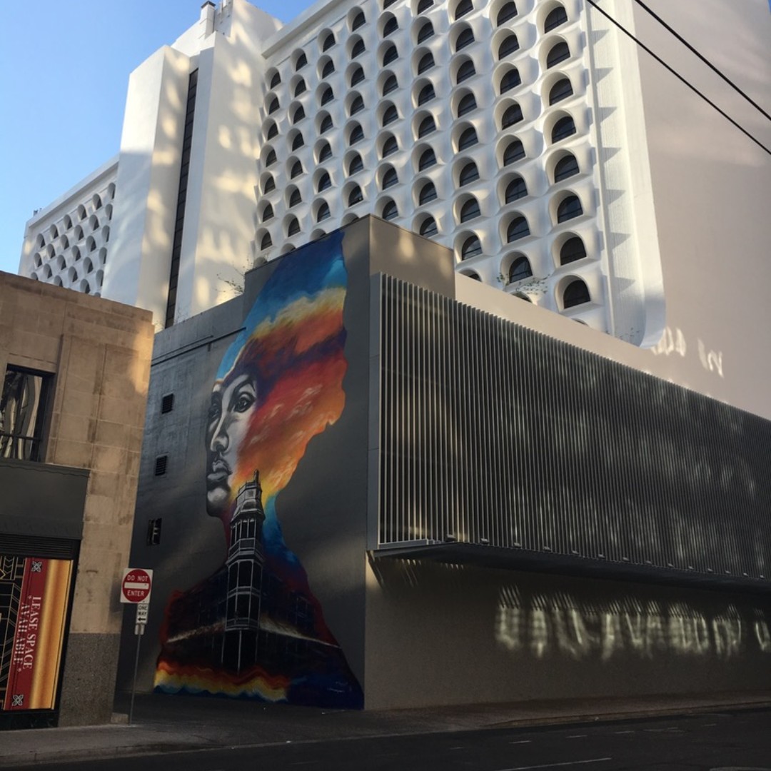CityofPhoenixAZ's tweet photo. This #mural in downtown #Phoenix marking Melinda’s Alley, named after an old woman who lived there behind the Adams hotel back in the early #1900s. She would take in strangers who were down on their luck or give them money, always taking care of other people. Her memory lives on. https://t.co/NR5WY2m6kn