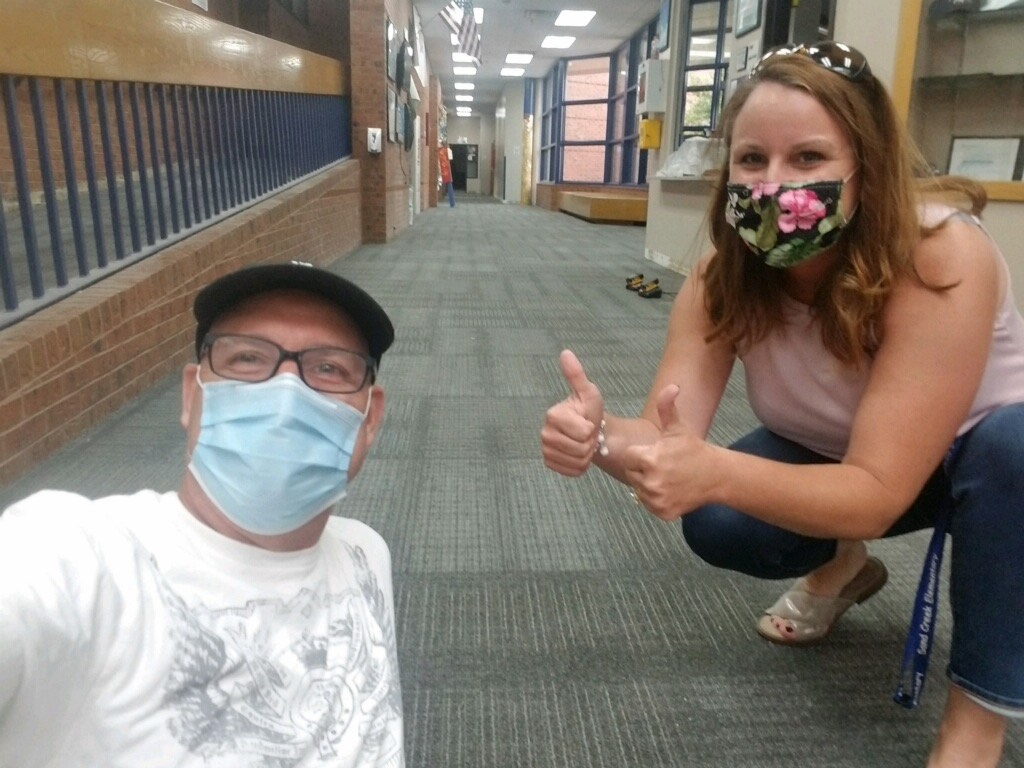 Mrs. Pekarek &amp; Mr. Dave showing off Sand Creek's new carpet!  (thanks to funding from Mill Levy Override (5A) and Bond (5B) Nov. 2018).💙  🦅