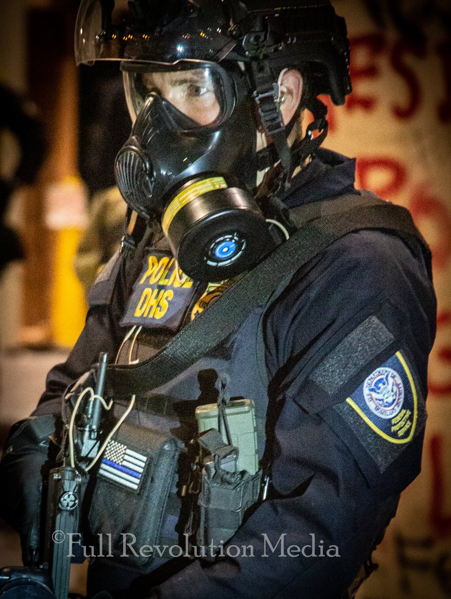 Dark uniform with DHS label are Federal Protective Services and I found are actually private police that fall under DHS authority. Notice this cop is wearing a  #BlueLivesMatters patch.  #BLUELIVESMURDER  #BlueLiesMurder