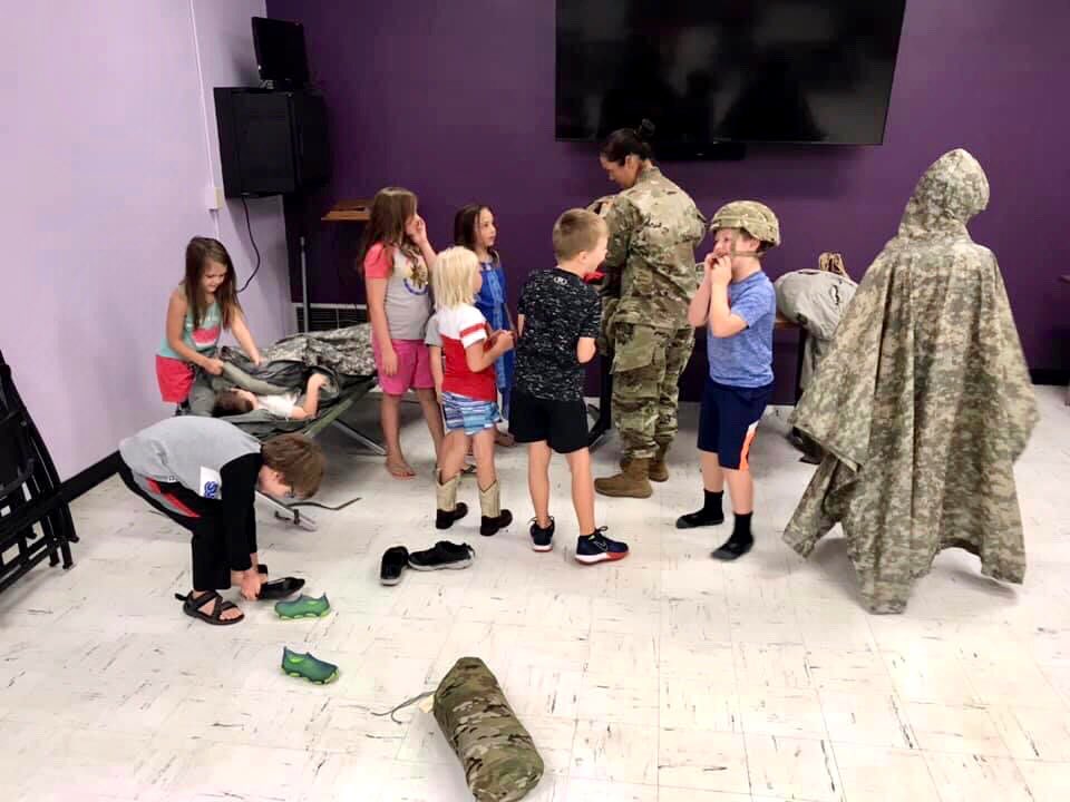 York_ParkandRec's tweet photo. On Tuesday, at Hometown Heroes, we got to learn all about the National Guard. The kids loved getting to try on the equipment and taste an MRE. They even worked together and put together a tent. #YPR #YorkParksAndRec https://t.co/uJubb7WIX6