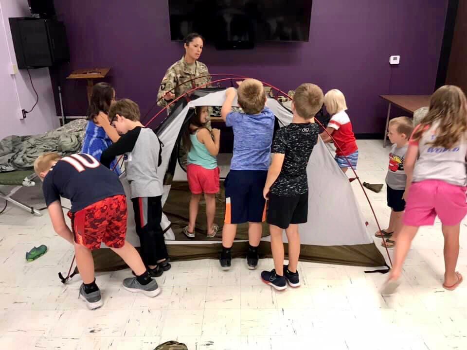 York_ParkandRec's tweet photo. On Tuesday, at Hometown Heroes, we got to learn all about the National Guard. The kids loved getting to try on the equipment and taste an MRE. They even worked together and put together a tent. #YPR #YorkParksAndRec https://t.co/uJubb7WIX6