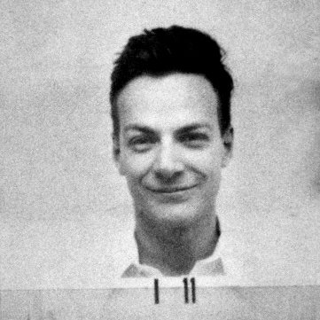 Richard Feynman, a joker known for cracking safes in Los Alamos for a prank, has calculated a truck windscreen will protect his eyes from UV. He is sat in the driver’s seat, waiting for the bomb like it’s a drive-in movie. Ernest Lawrence has decided to do similar.