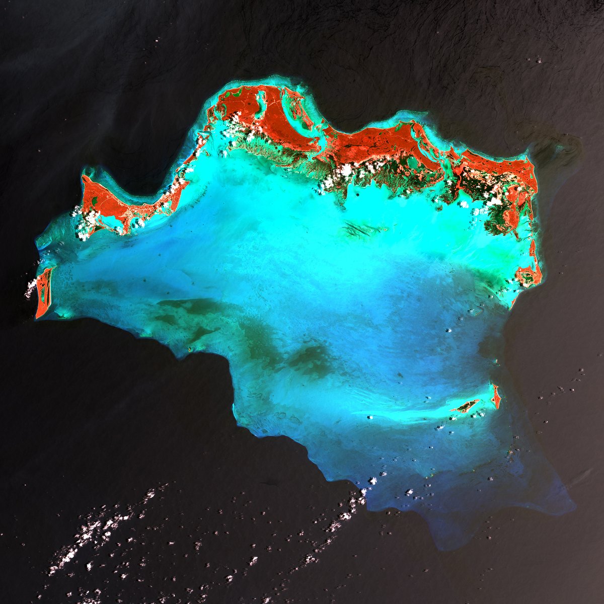 The Caicos Islands (pronounced KAY-kohss) in the northern Caribbean lie along the northern perimeter of the submerged Caicos Bank (turquoise). A shallow limestone platform made of sand, algae, and coral reefs covers 6,140 sq kilometers (2,370 sq miles). 📷Photo &amp; caption by <a href="/USGS/">USGS</a>