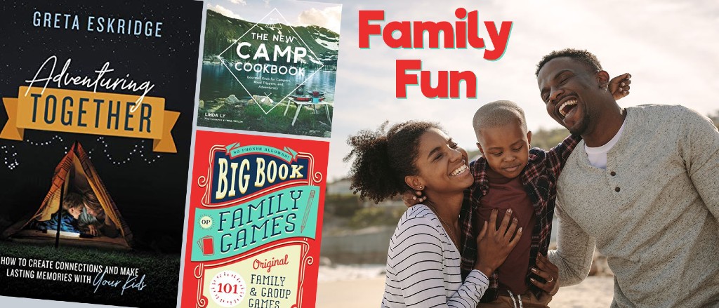 a family smiling and laughing together, a man and woman woth holding a little boy between them