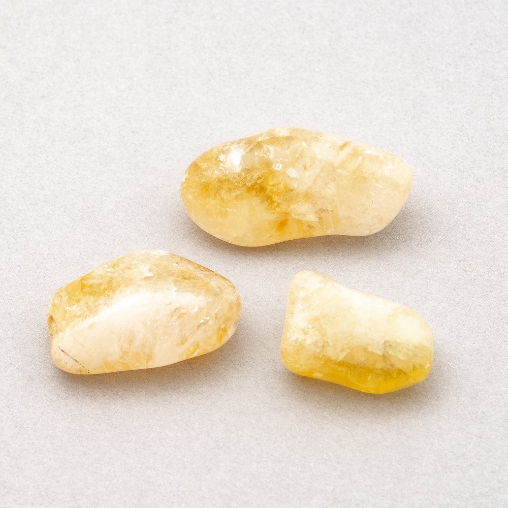citrine - a transparent yellow generally - associated with the solar plexus chakra - natural purifier: collects, transmutes, ground and disappates negative energy - helps to aid with manifestions - helps increase positivity within by easing heavy feelings/emotions