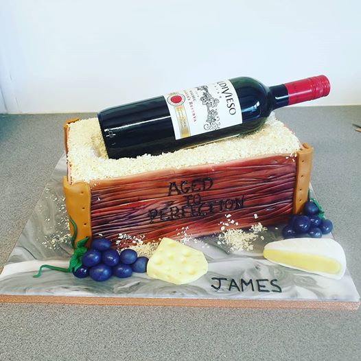 'Aged to Perfection' cake for a 60th birthday. Edible wine box with cheese and grapes made from sugarpaste and a real bottle of #wine #cheeseandwine #birthdaycake