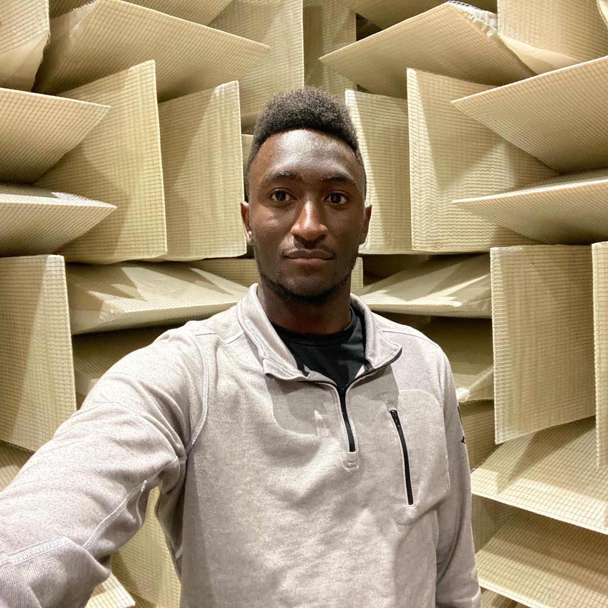 MKBHD's tweet photo. Throwback to visiting the quietest room on earth. It's a sealed room within a room. Every wall is insulated. The door is 4 feet thick. There is no floor, only suspended wire. Sitting still you can clearly hear your heartbeat and your own blood blowing... So yeah, studio goals https://t.co/SOchzWgkEF