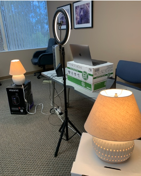 6.Putting all together: Now that you have your station set up in a  space, your camera at  level, and your lighting, you are all set! This is how our UCSD interview station looks as an example. Play around with your setup and make it personal!