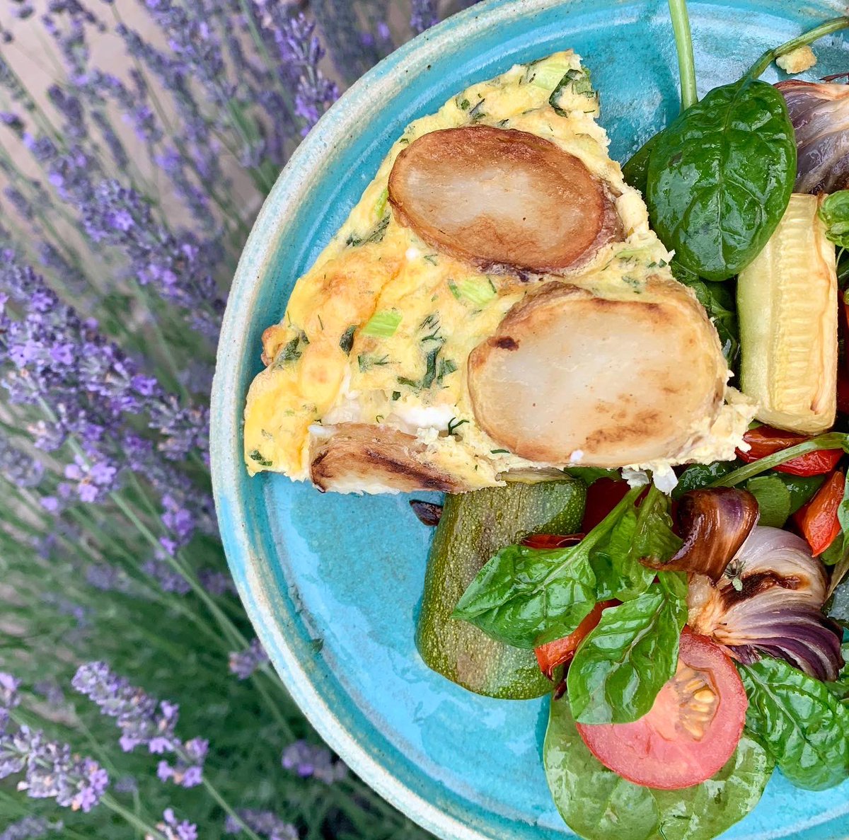 Cluckmuckcook's tweet photo. Feta cheese and herb #frittata with a roasted veg salad. Catching up on the #leithscooking #nutrition course. The last picture was “for the gram”, balancing a plate over the lavender bush whilst trying not to get attacked by bees 🐝🤪🤷🏻♂️🤣. #fitfood #5aday https://t.co/PhO4x1mSnJ