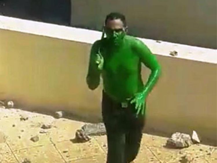 HSahnuni's tweet image. An Egyptian man - wielding two knives and painted green -was shot dead by police after he attempted to storm the media production city in Cairo, Egyptian media reported.