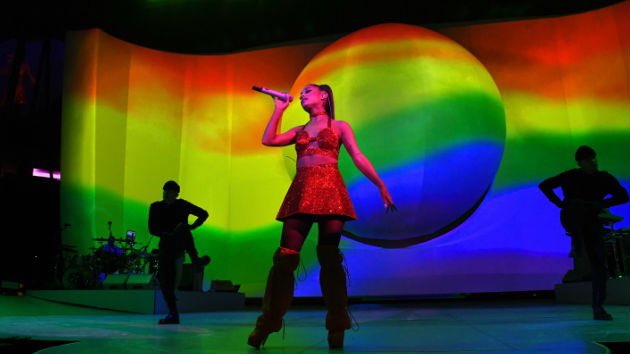 has showed support for the LGBTQ+ community by having a pride visual at her Sweetener World tour / holding a pride flag at some shows.