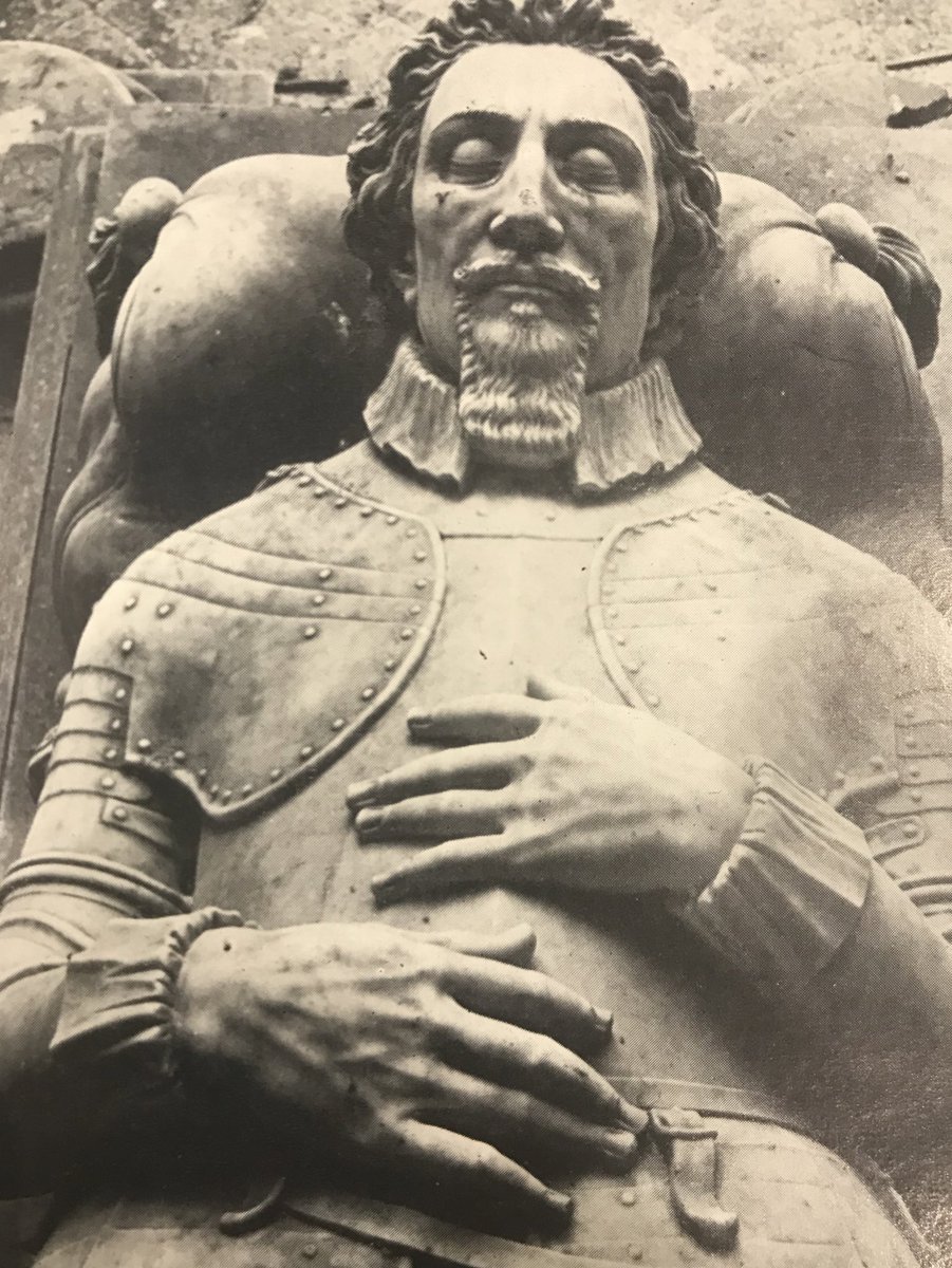 The alabaster base, has serpentine panels, and carries life-size recumbent effigies in Carrara marble. Carved by Sir Nicholas Stone in about 1630, Moyle Finch wears armour and his eyes are closed. Lady Elizabeth is dressed in a buttoned bodice and falling ruff. Her eyes are open.