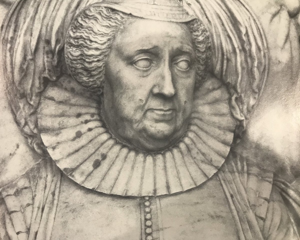 The alabaster base, has serpentine panels, and carries life-size recumbent effigies in Carrara marble. Carved by Sir Nicholas Stone in about 1630, Moyle Finch wears armour and his eyes are closed. Lady Elizabeth is dressed in a buttoned bodice and falling ruff. Her eyes are open.