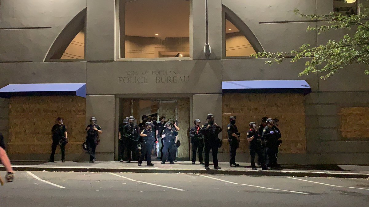 More officers standing outside the back door to the JC. They’re keeping the door open. The crowd is chanting “let him go;” a protester near me says that they’re referring to someone who was arrested for jaywalking earlier.